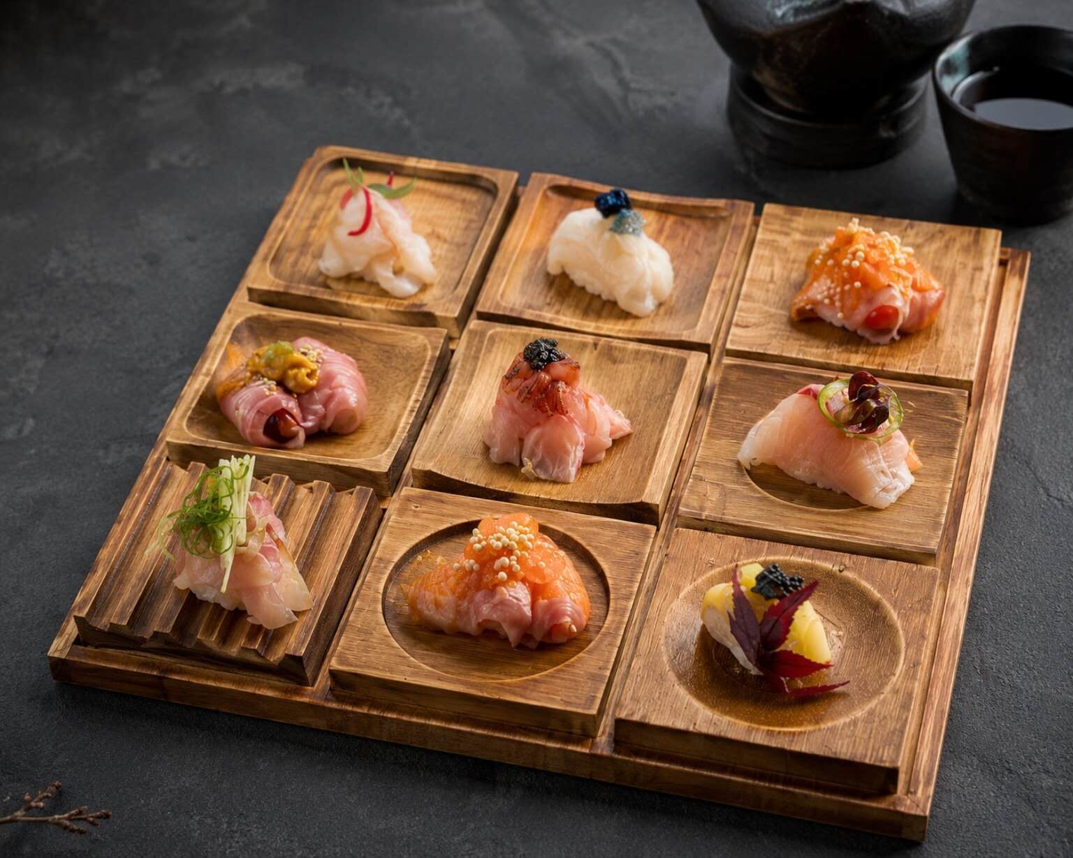 Rainbow roll topped with assorted sashimi
